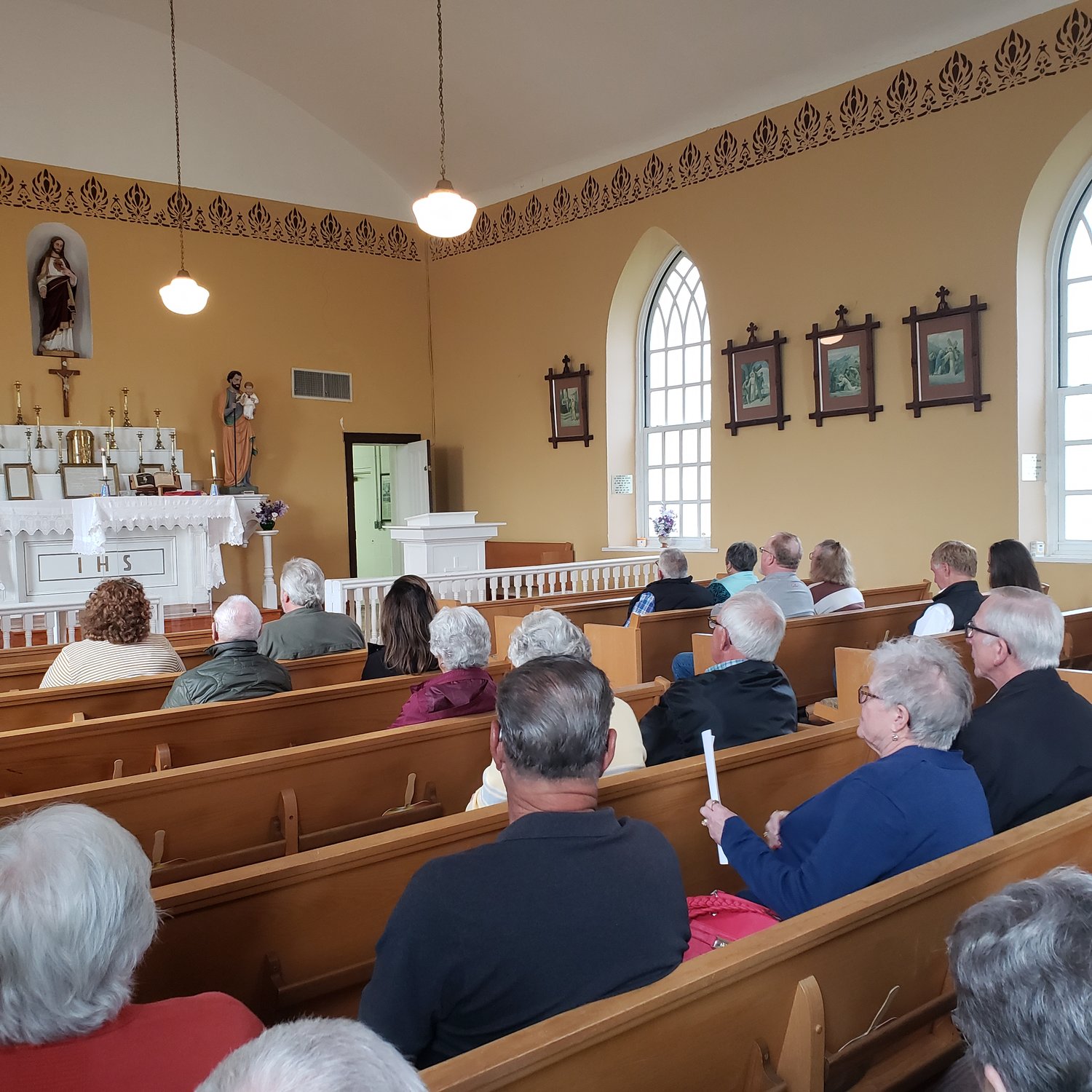 Father John Henderson offers Mass in historical St. Paul Church in rural Center, Missouri, on April 28, 2022.